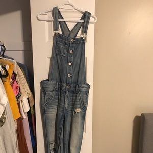 Distressed jean overalls